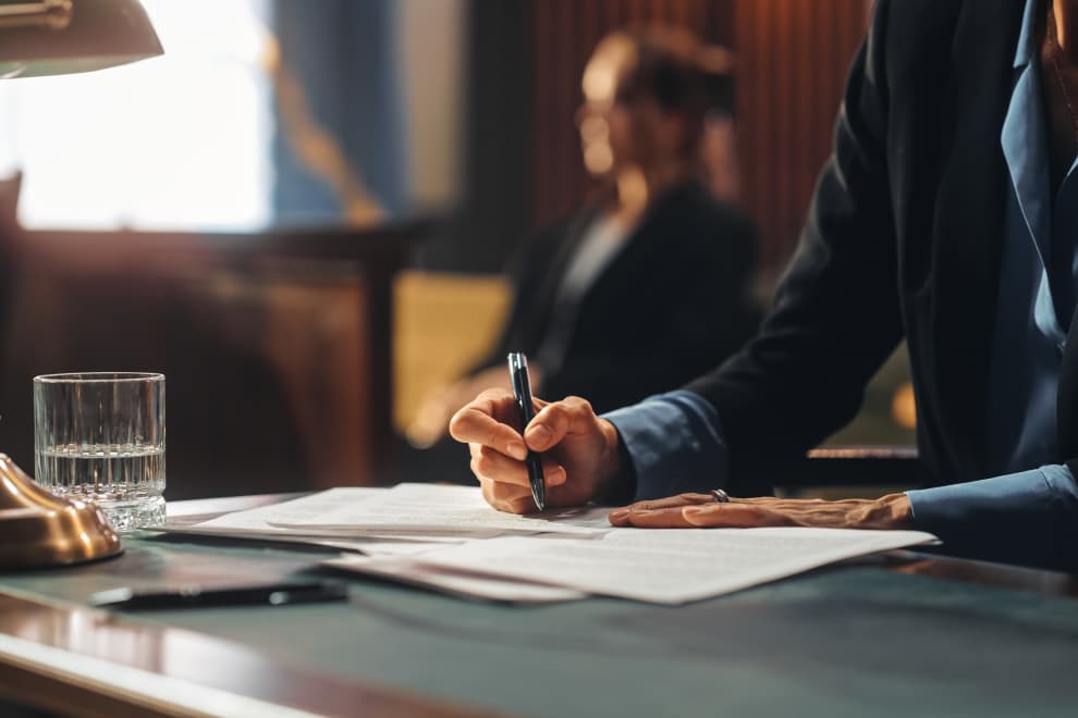 Someone signing a document. 