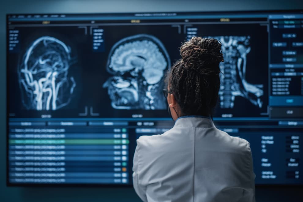 Woman looking at brain scans. 